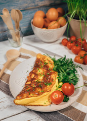 Omelet with ruccola and cherry tomatoes