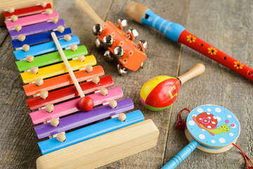 Musical instruments on wooden background