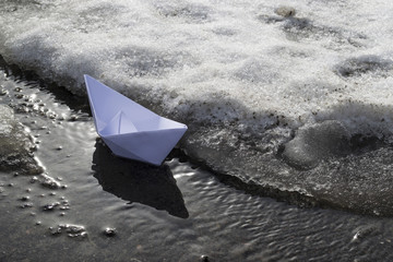 paper boat on the water
