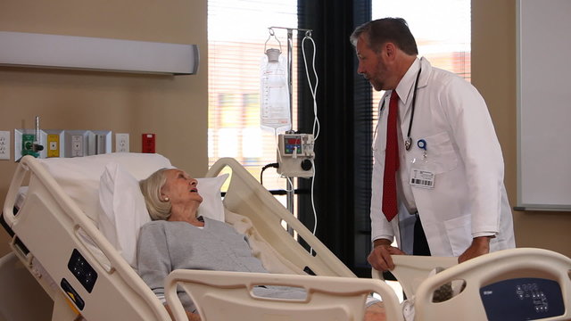 Doctor talks to elderly patient