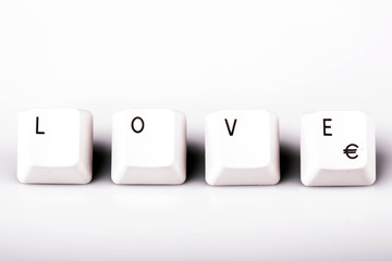 text love formed with computer keyboard keys on white background