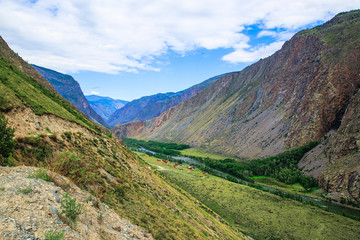 mountain valley in summer day clouds Altai