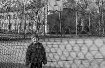 little boy playing on the sport playground