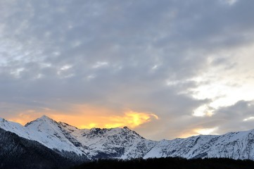 Sunset with dramatic sky over mountain