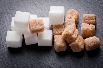 White and brown sugar cubes closeup.