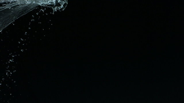 Water splash on black background, slow motion