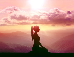 Yoga and meditation. Silhouette of woman.