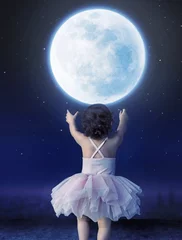 Wandaufkleber Little baby girl reaching to the moon © konradbak