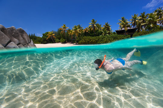 Woman snorkeling at tropical water