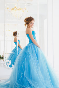 Beautiful Bride In Gorgeous Blue Dress Cinderella Style In A Morning Near Mirror