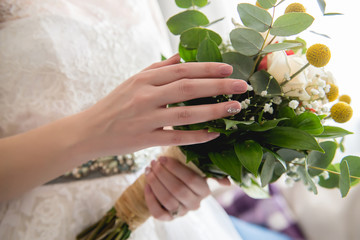 Bridal bouquet in the hands of the bride