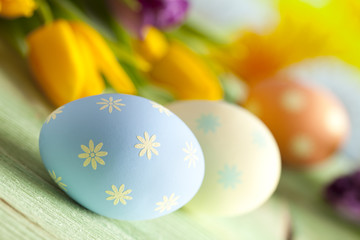 Colorful Easter eggs and spring flowers
