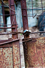 Rusted lock on old gate