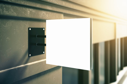 Square Signboard On Grey Building