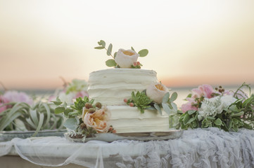 Delicate wedding cake with pink peonies