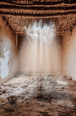 Light rays leak inside old building in Iraqi countryside