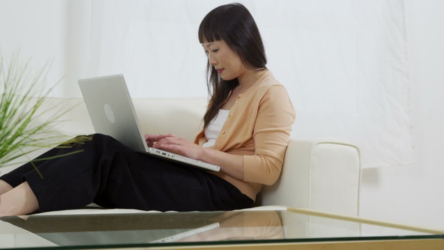 Asian woman using laptop computer