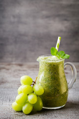 Grape smoothie, on the grey  background.