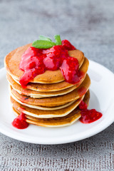 Stack of pancakes with fresh berry.