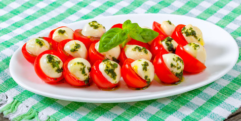cherry tomatoes and baby-mozarella cheese caprese salad on, clos