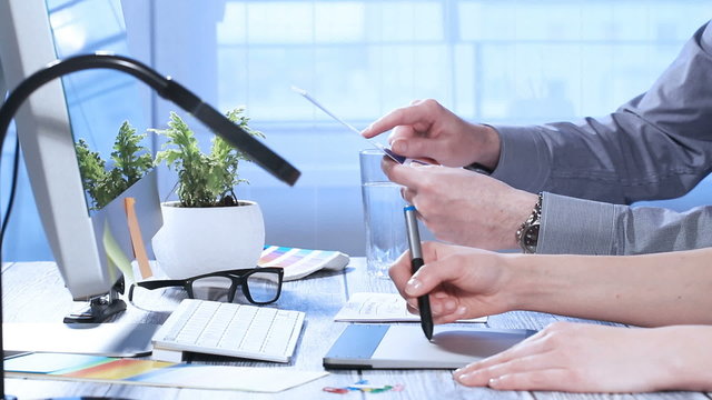 Graphic designer at work. Color swatch samples.