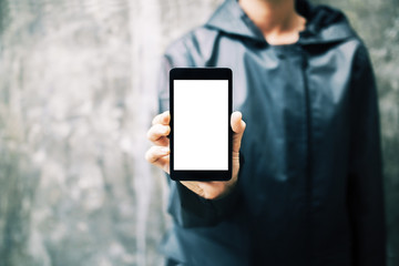 Girl holding white smartphone