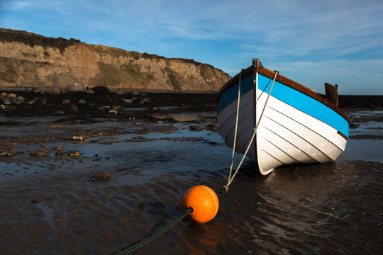Boat on beach at low tide