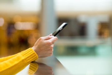 Woman use of cellphone at shopping mall