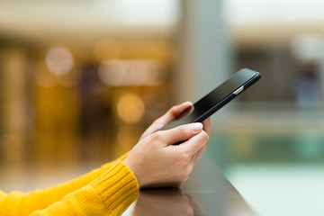Woman use of smartphone at shopping mall