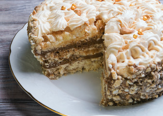 Large round air meringue cake with chocolate layer