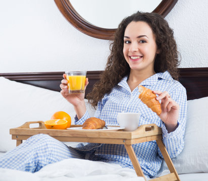 Adult Girl With Juice And Croissant In Bed