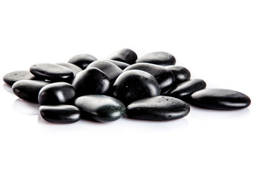 Fototapeta na wymiar Zen pebbles. Black spa stones isolated on white