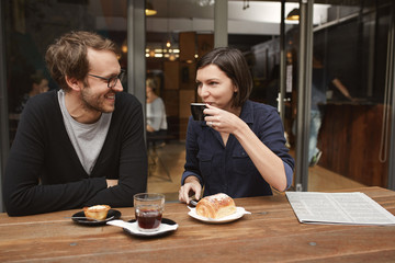 Candid shot of a young couple at outdoor cafe