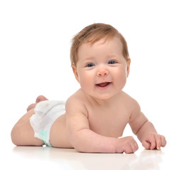Four month Infant child baby girl in diaper lying happy smiling