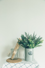 Glass bowl with a wooden spoon, put a fake tree in the little cans, old kitchen vintage.