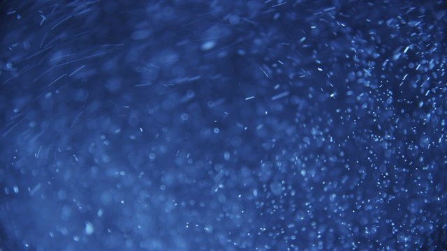 Flying particles, blue tone, background