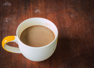Coffee. Cup Of Coffee on brown desk