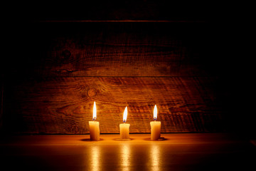 Obraz na płótnie Canvas Background with candles light on wood
