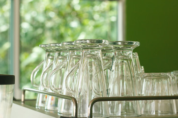 Clean glasses on shelves.