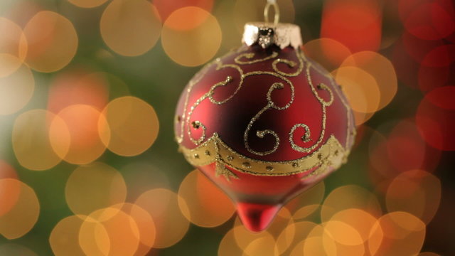 Christmas ornament with blurred lights in background