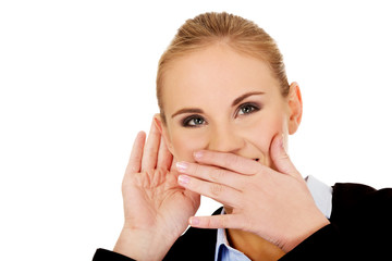 Young woman  overhears conversation and giggles