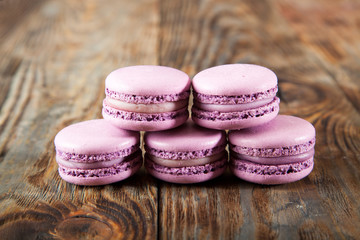 Still life with tea and delicious sweet blueberry macarons