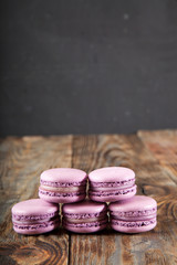 Still life with tea and delicious sweet blueberry macarons