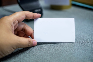 White card in a hand