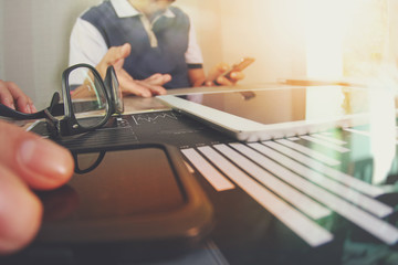 business documents on office table with smart phone and laptop c