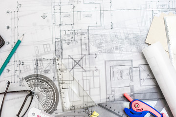 Construction planning drawings on the table with pencils, ruler