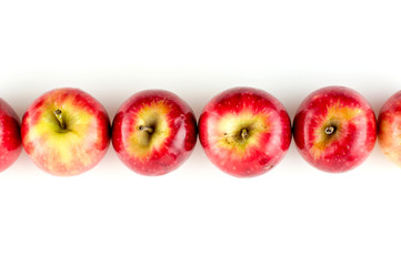 Aerial view of row of shiny apples studio isolated