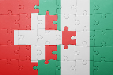 puzzle with the national flag of switzerland and nigeria