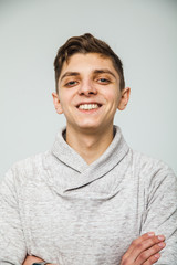 Portrait of the young happy smiling man isolated on a white background