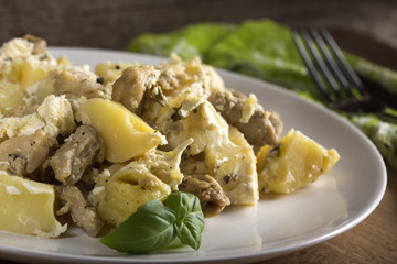 Potatoes gratin with chicken
